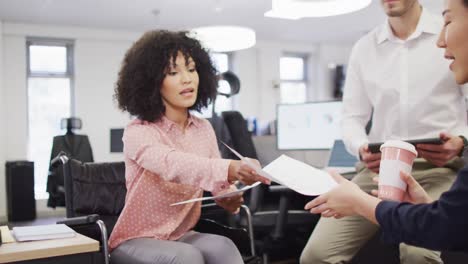 Diverse-business-people-discussing-work-at-office,-slow-motion