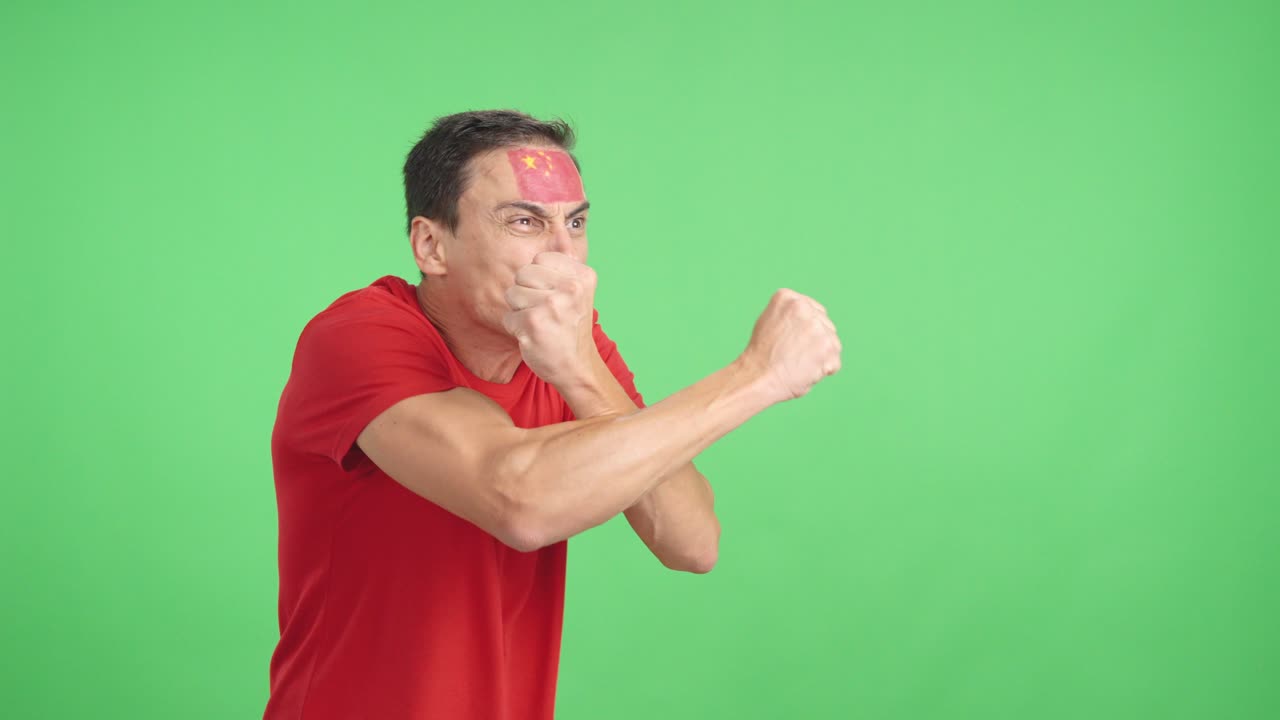 Man cheering for China, angry with the decision of referee