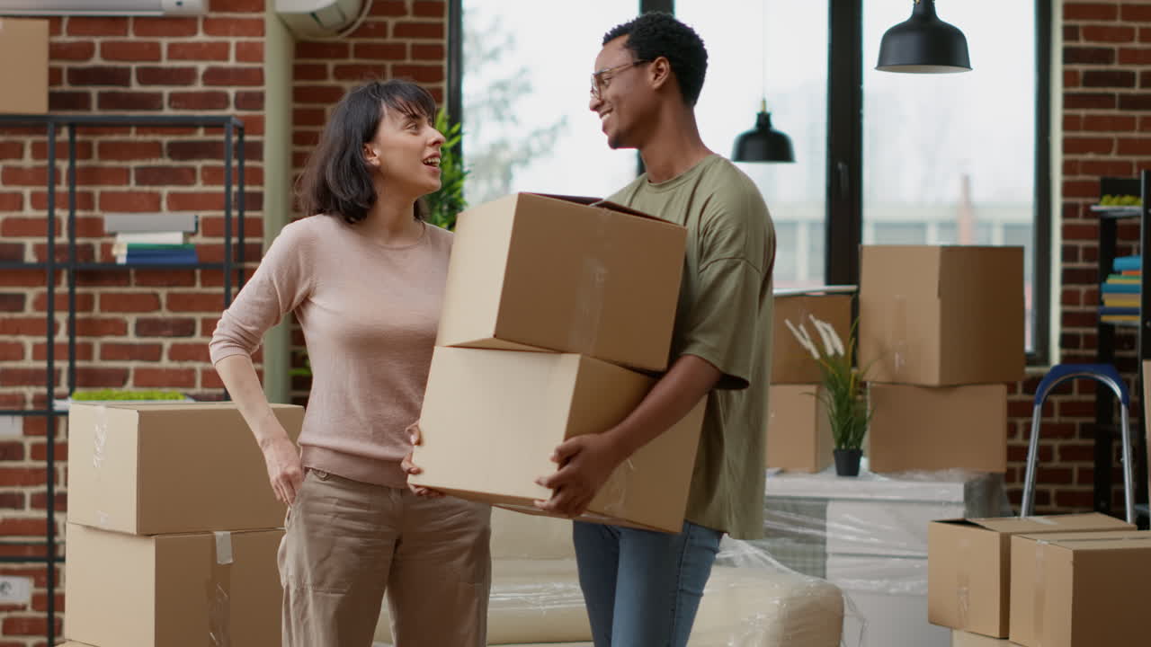 Woman and african american man celebrate having house keys