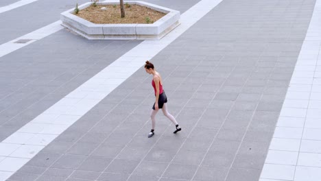 female ballet dancer performing on pavement 4k