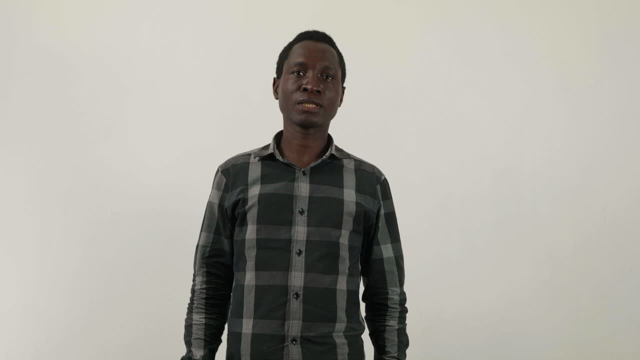 African man puts on visor for covid corona virus