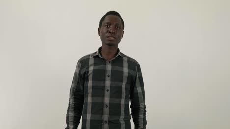 african man puts on visor for covid corona virus