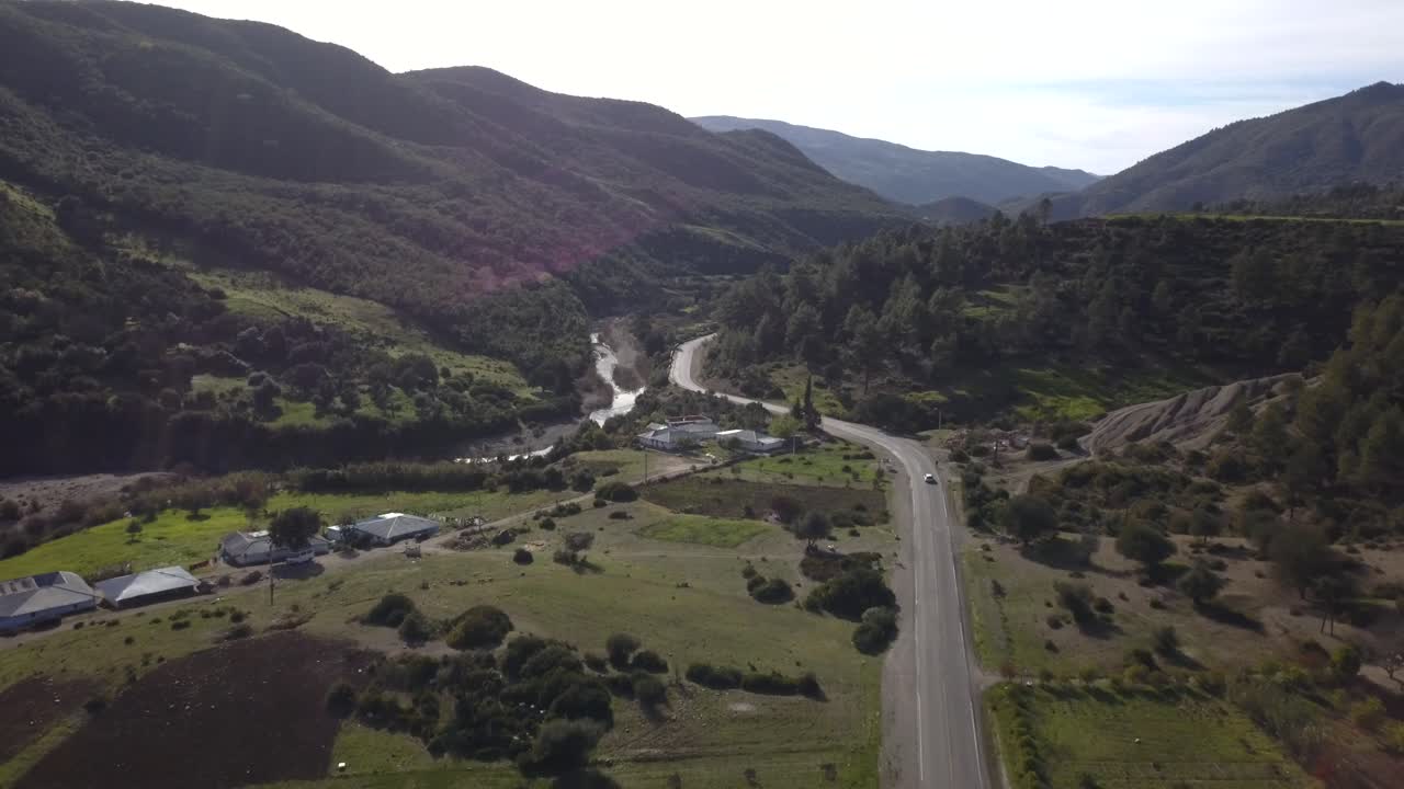 AERIAL: Car Driving in Road with Trees in Morocco