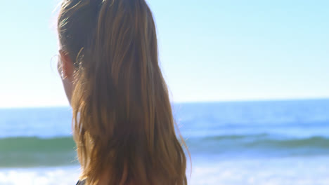 fit woman walking in the beach 4k