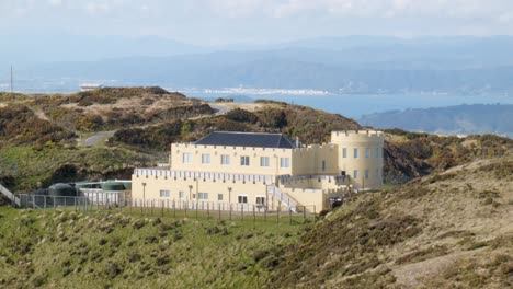 a modern castle on top of a mountain