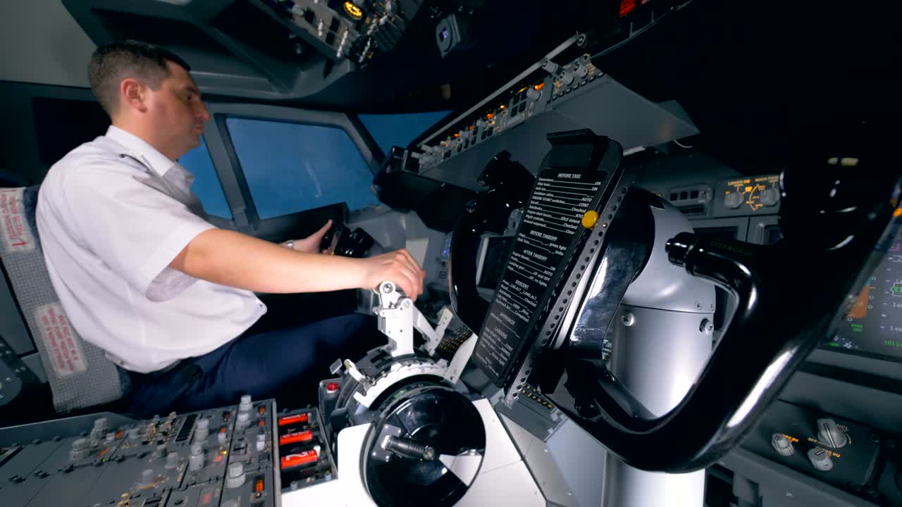 Steering wheel on in a flight simulator, close up.