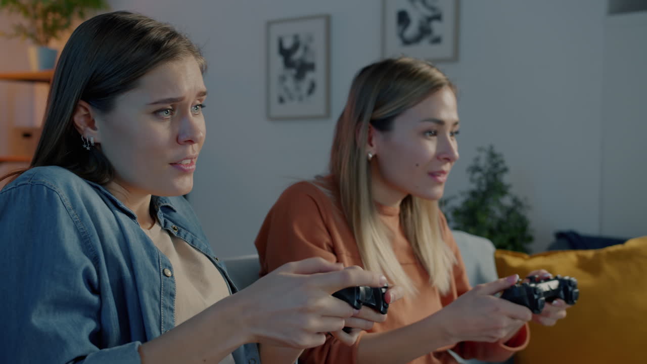 Two Women Playing Video Games at Home
