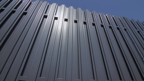 grey metal fence against blue sky