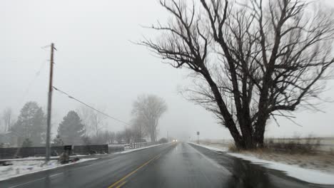 pov footage of driving in the countryside of boulder, colorado during a snowstorm