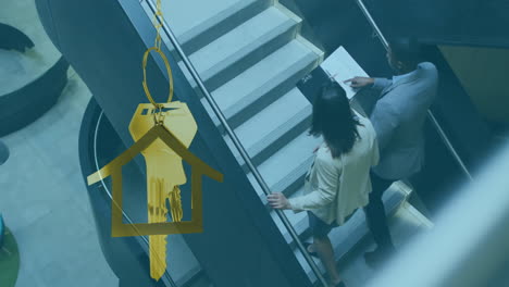 animation of gold house key and key fob over diverse businesspeople