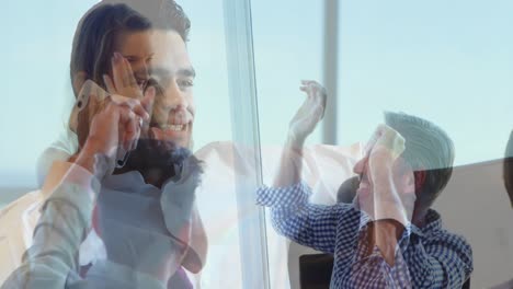 Animation-of-caucasian-businessman-having-call-over-happy-businesspeople-clapping-hands