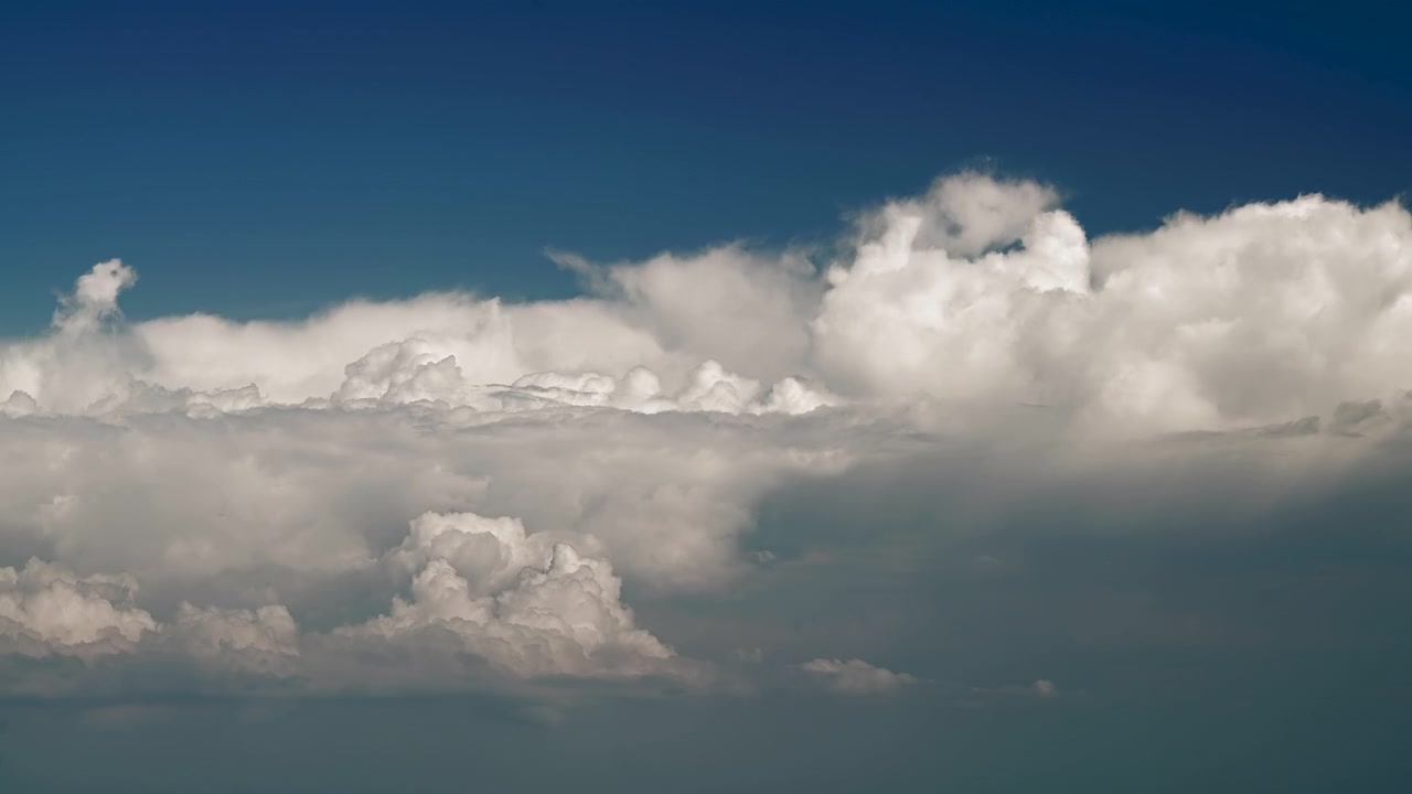 Time Lapse of White Clouds Moving Across a Deep Blue Sky