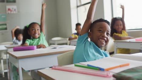 Video-of-happy-african-american-boy-raising-hand-during-lesson