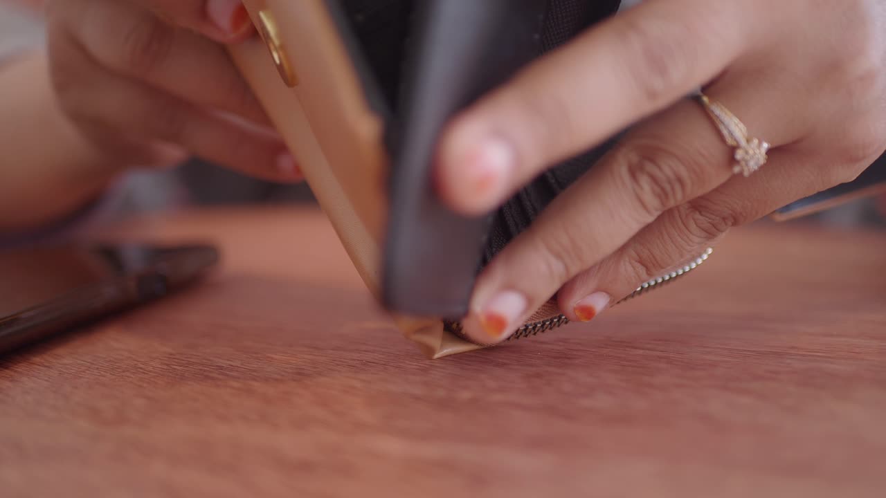 Woman opening a wallet and purse