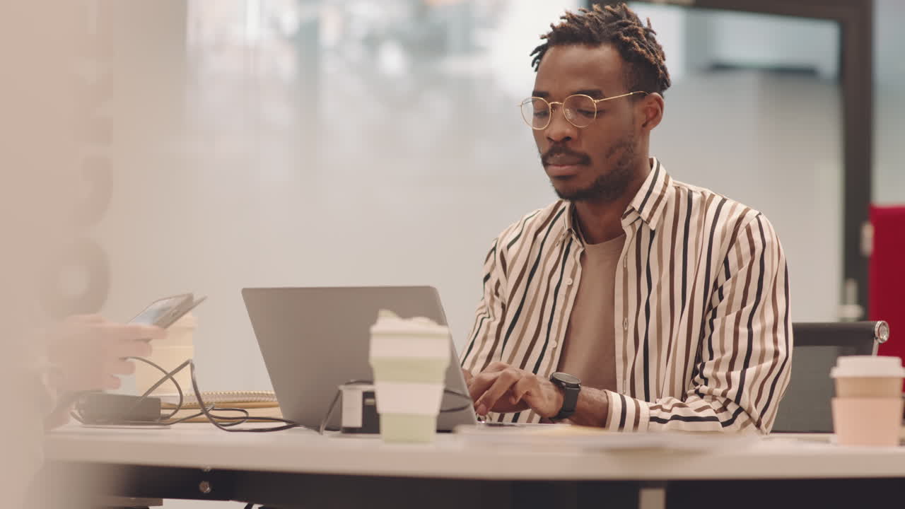 African American IT Student Working on Laptop