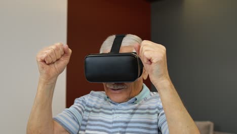 elderly man excitedly using virtual reality headset