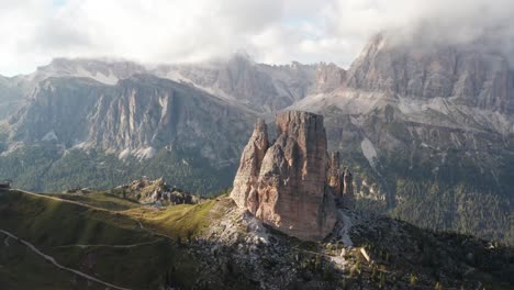 iconic cinque torri towers in sunlight, tofane range in background, dolomites