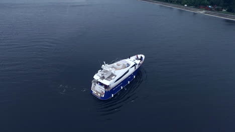 Aerial-view-of-cruise-yacht-on-water.-Vacation-party-on-ship.-Boat-on-river