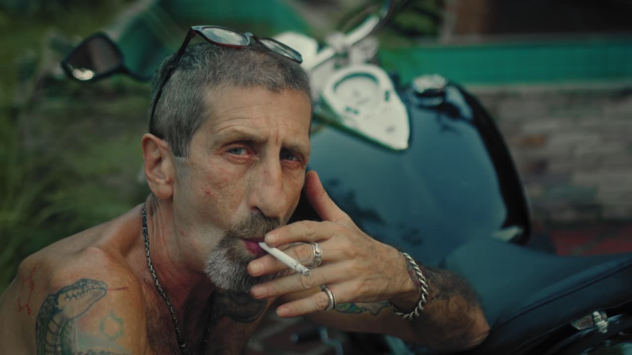 Older Man with Tattoos and a Motorcycle
