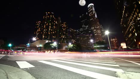 a time lapse of downtown la at night during a full moon