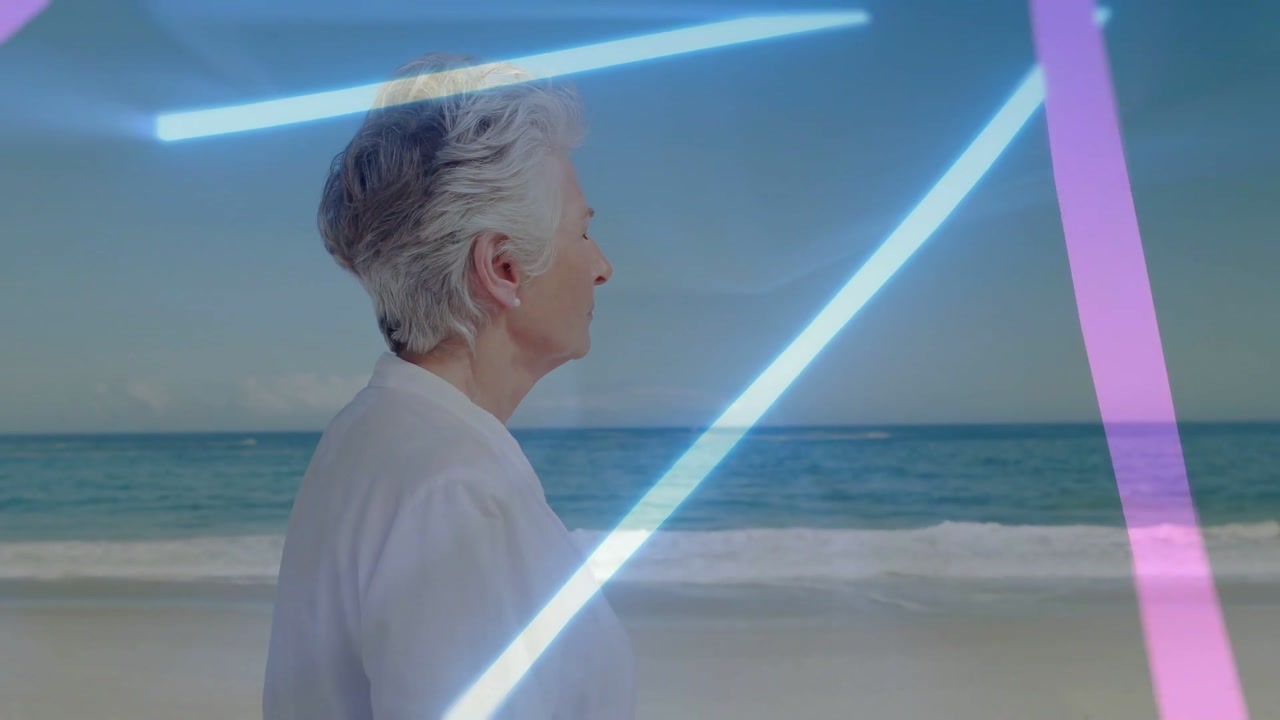 Senior woman standing at sea, scene starting, neon lines growing and overlaying face for tech