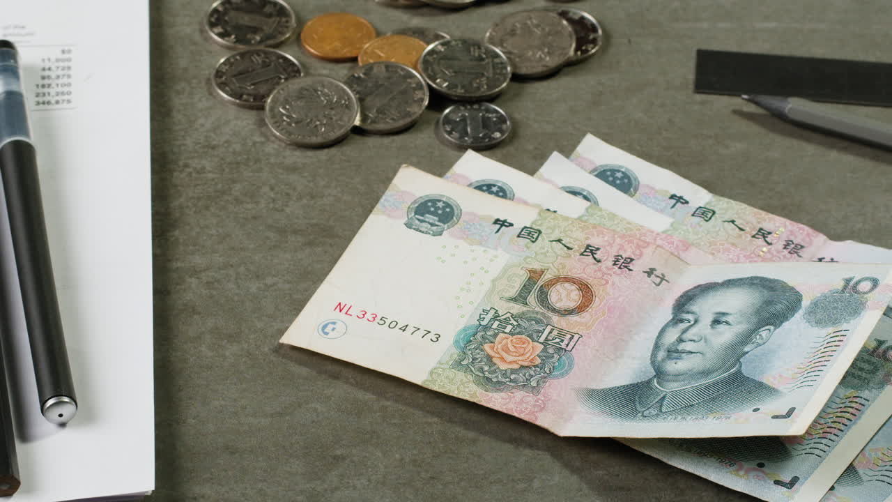 Chinese Yuan and Coins on a Desk