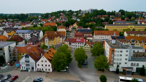 4k aerial drone video of the historic homes near the hofgarten garden and orangerie event venue in downtown ansbach, germany