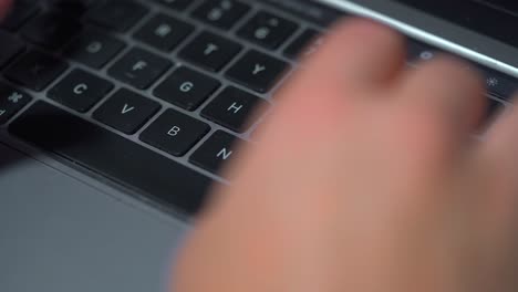 close-up office typing on a laptop keyboard in the office