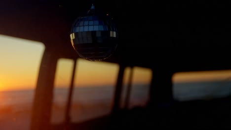 Close-up-of-mirror-ball-hanging-in-van-4k