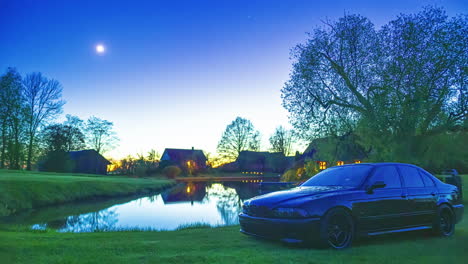 a bmw m5 - e39 car model parked near the lakeshore at sunset