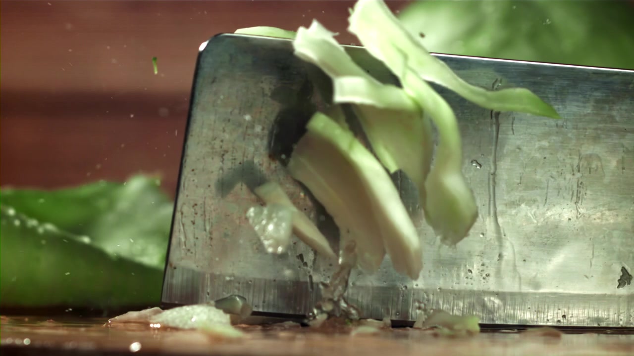 Fresh Cabbage Chopped by a Knife in Slow Motion