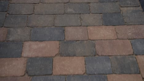 path of orange brick paving work using a range of square and different coloured brick material