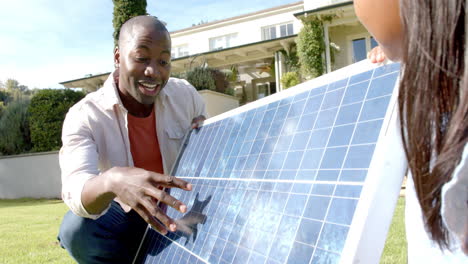 explaining solar panel installation, african american man promoting renewable energy to woman in bac