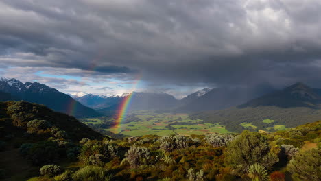 vibrant rainbow over a lush mountain valley