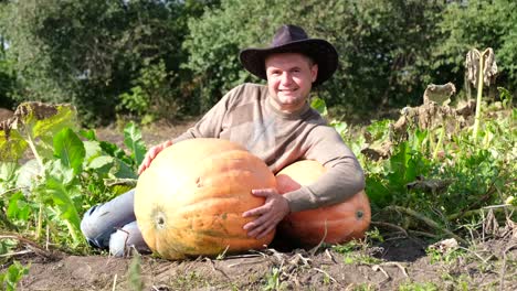 farmer posing with pumpkins