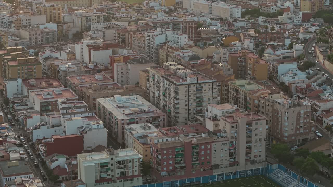 apartment blocks and rooftops forming dense Malaga cityscape