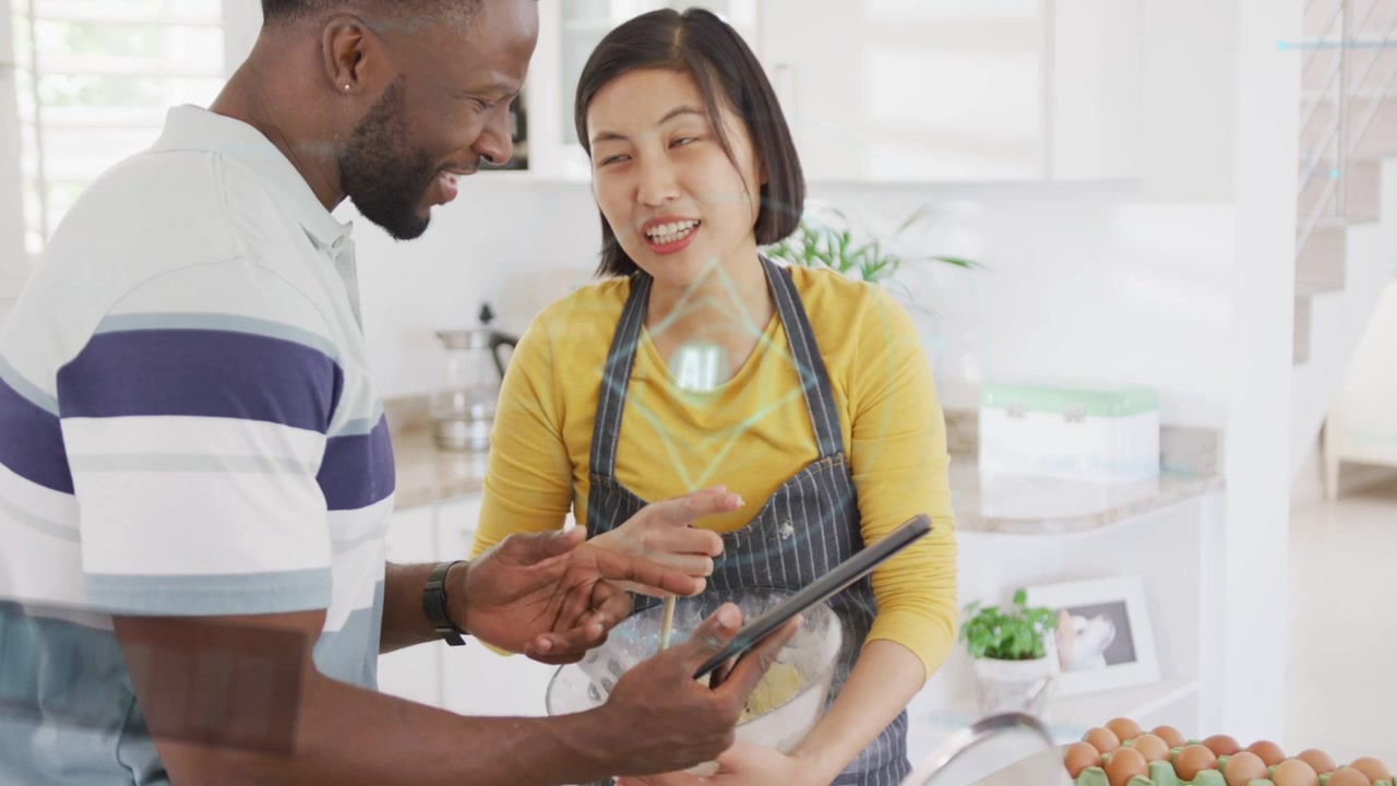Tablet displaying recipe starting couple consulting, pointing, stirring and following steps