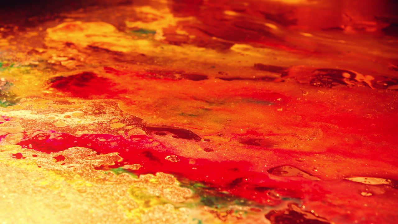 Colourful, organic, liquids macro shots buzzing and flowing