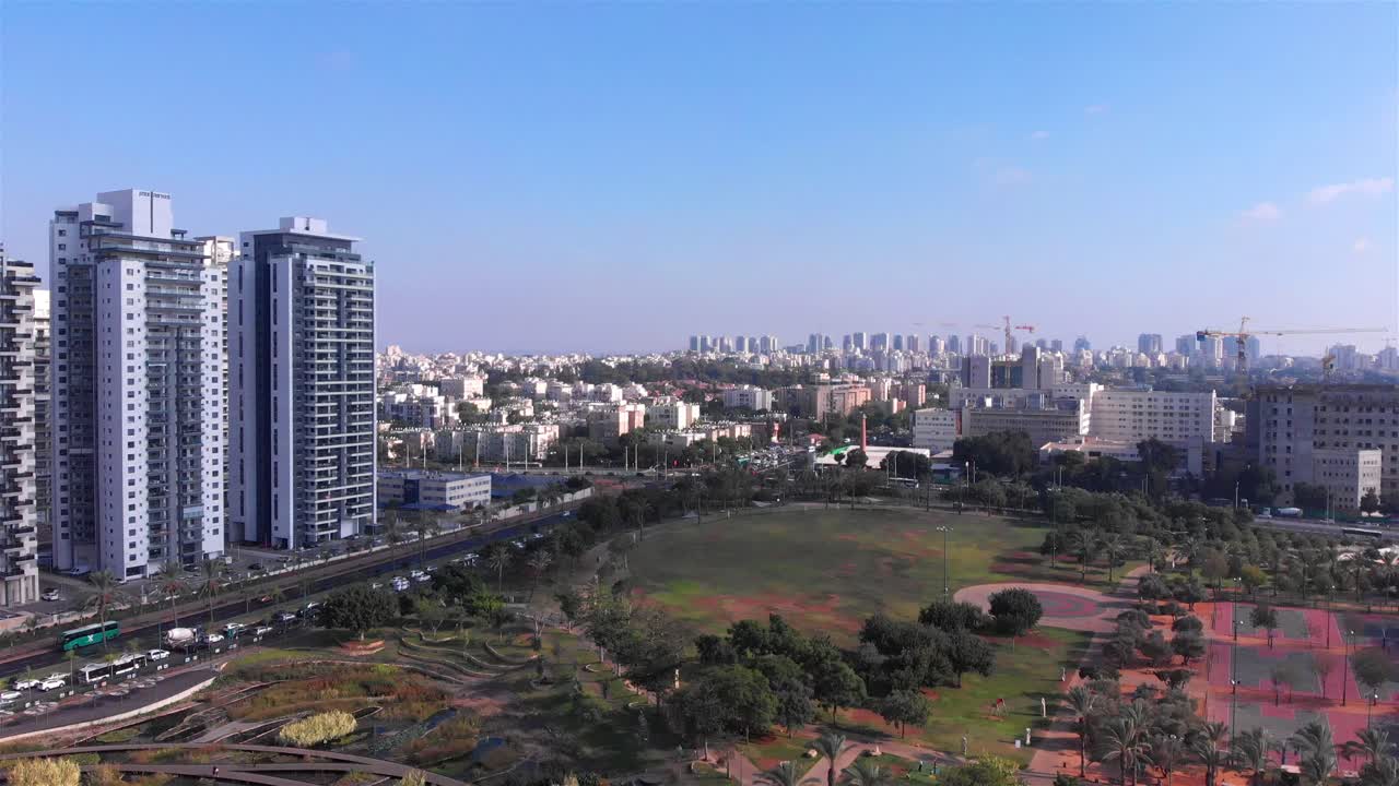 Aerial View of a Modern City Park and Skyline