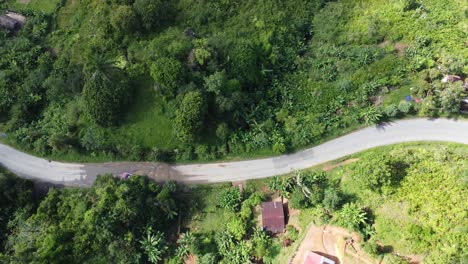 bus carefully avoids driving into pot holes in madagascar, africa