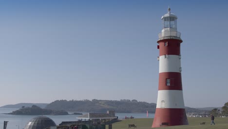 a wide view of smeatons tower in plymouth, devon on a bright sunny day