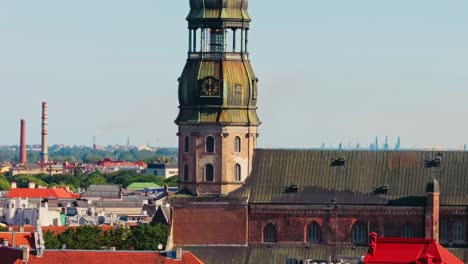 drone moves sideways with close telephoto view of riga st peters church tower