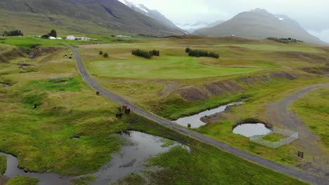 Aerial-of-green-mountain-landscape-in-Iceland-with-foggy-weather-during-autumn