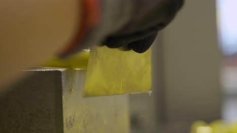 slicing and chopping of yellow caramel candies