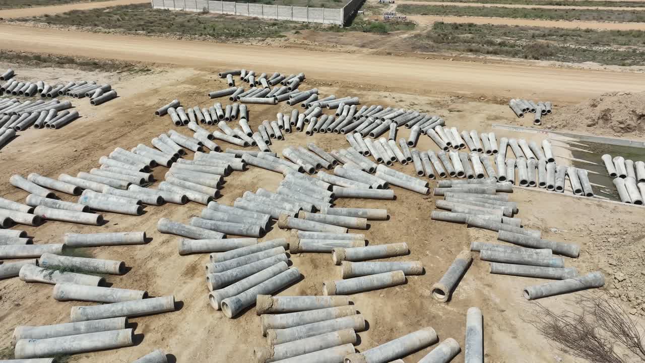 Aerial View Of Concrete Pipes Drying On Ground At Construction Site In Pakistan