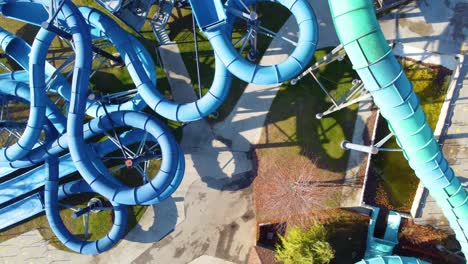 slowly rising above deserted serpentine slides at waterpark