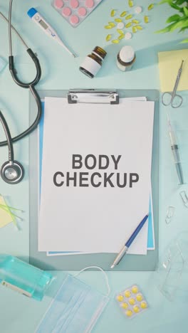 vertical video of body checkup written on medical paper