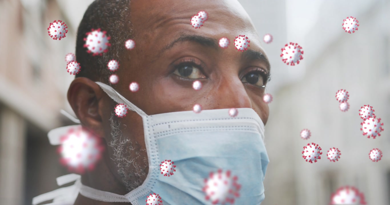 Black man wears mask in city for COVID-19 and pollution protection.