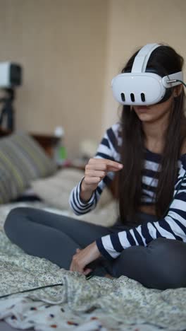 teenage girl using vr headset in bedroom