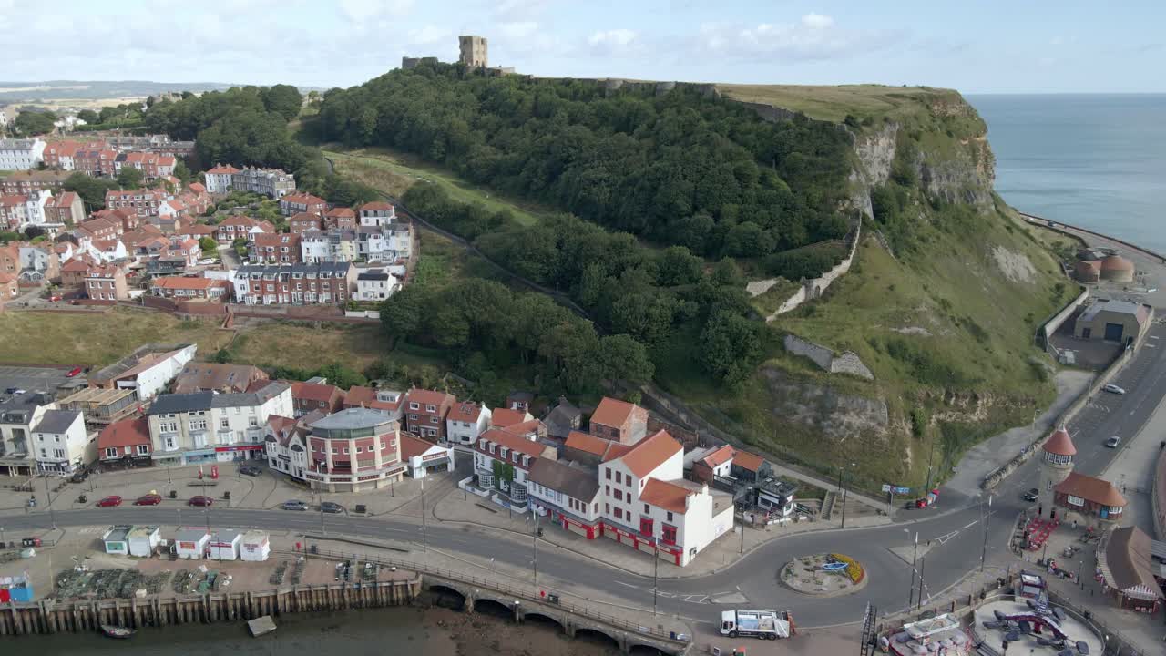 Aerial bird's eye view of Scarborough town, beach, harbour and castle